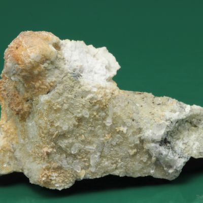 Monteregianite-(Y) (type locality) with Pectolite on Albite